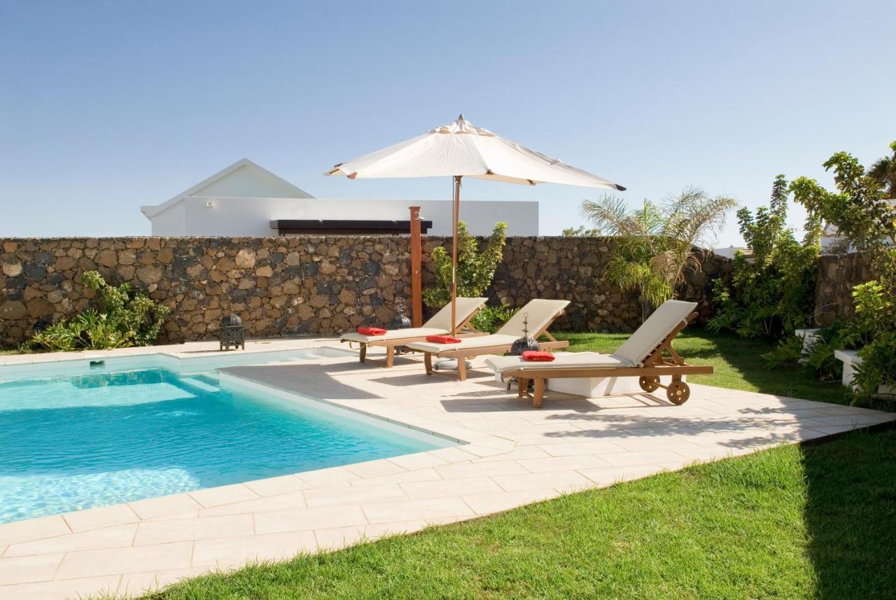 Coral Villas ปูแอร์โตเดลคาร์เมน ภายนอก รูปภาพ